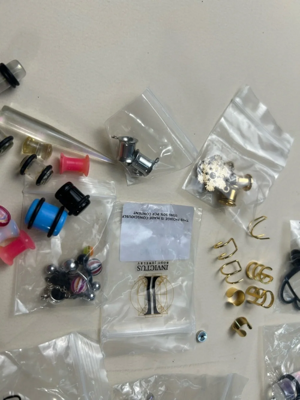 Jewelry: Earrings in various designs and sizes, and piercings.